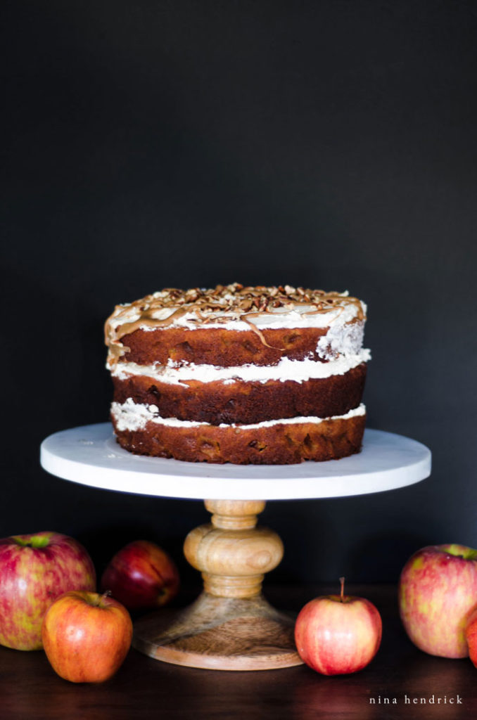 naked cake with salted caramel drizzle on cake stand