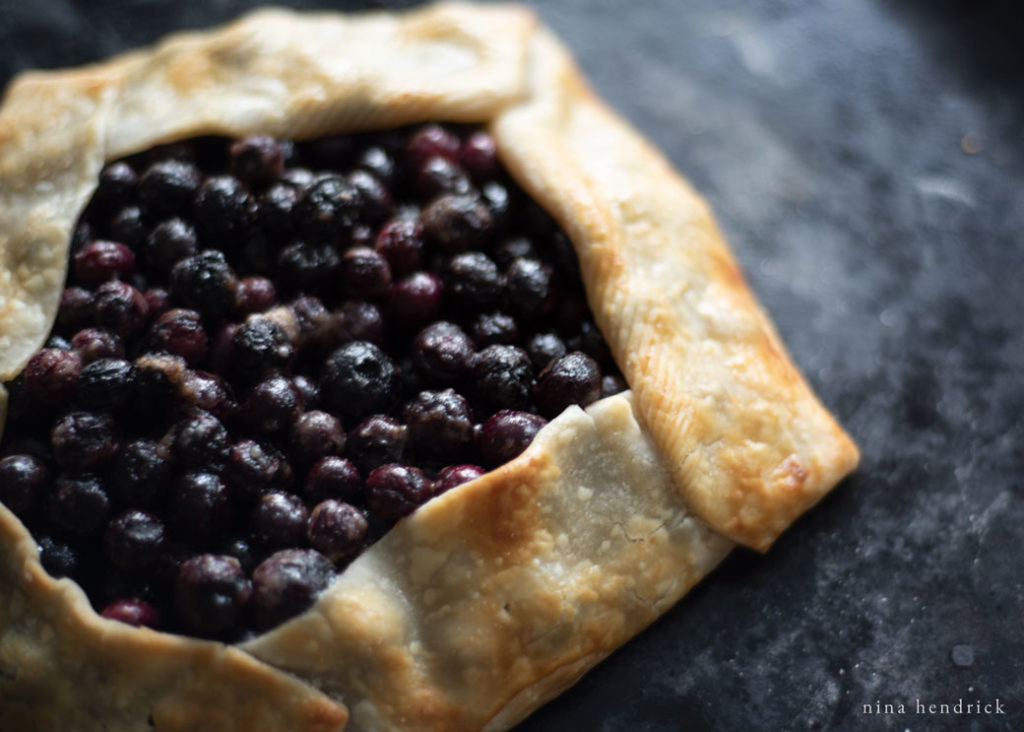 Blueberry crostata on a pizza stone