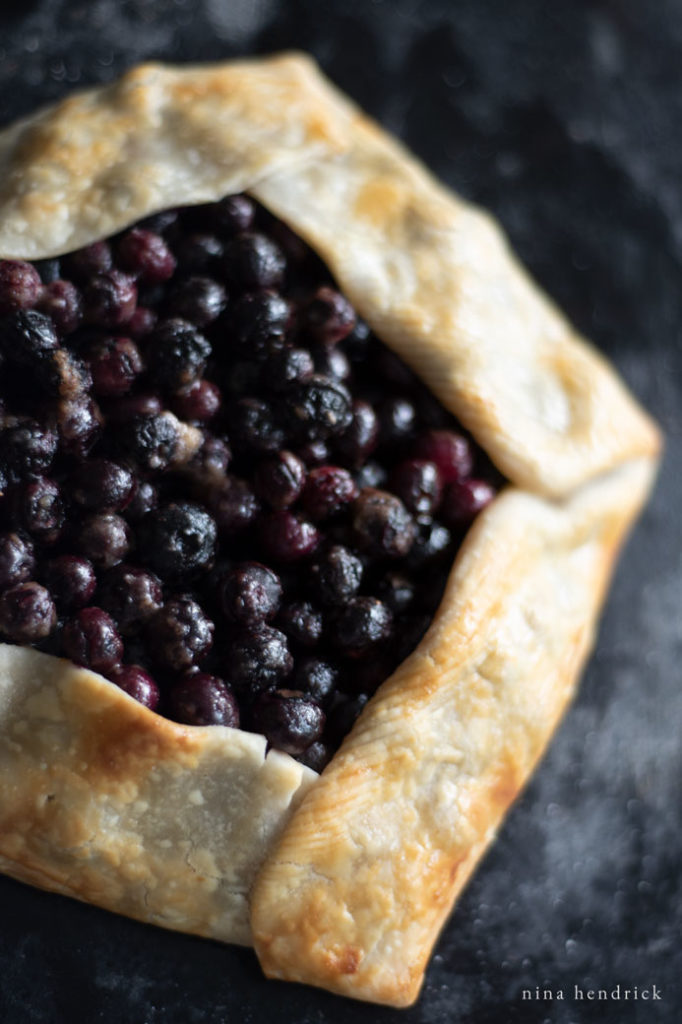 Overhead of rustic blueberry crostata