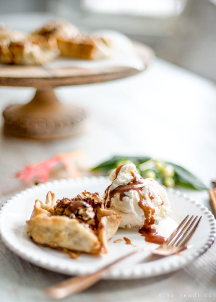 Apple Blossoms Recipe with Salted Caramel Sauce | Get the recipe for these crusty apple blossom tarts with oatmeal and coarse sugar topping and a salted caramel sauce. #applerecipe #appletarts #fallrecipes