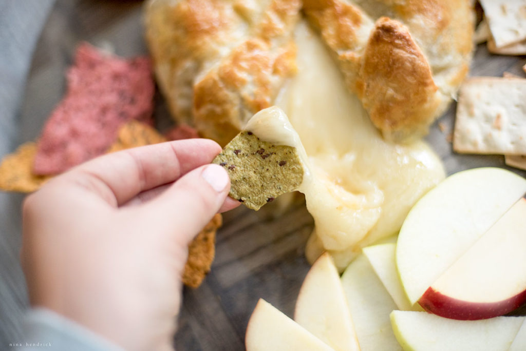 Baked brie with tortilla chips and apples