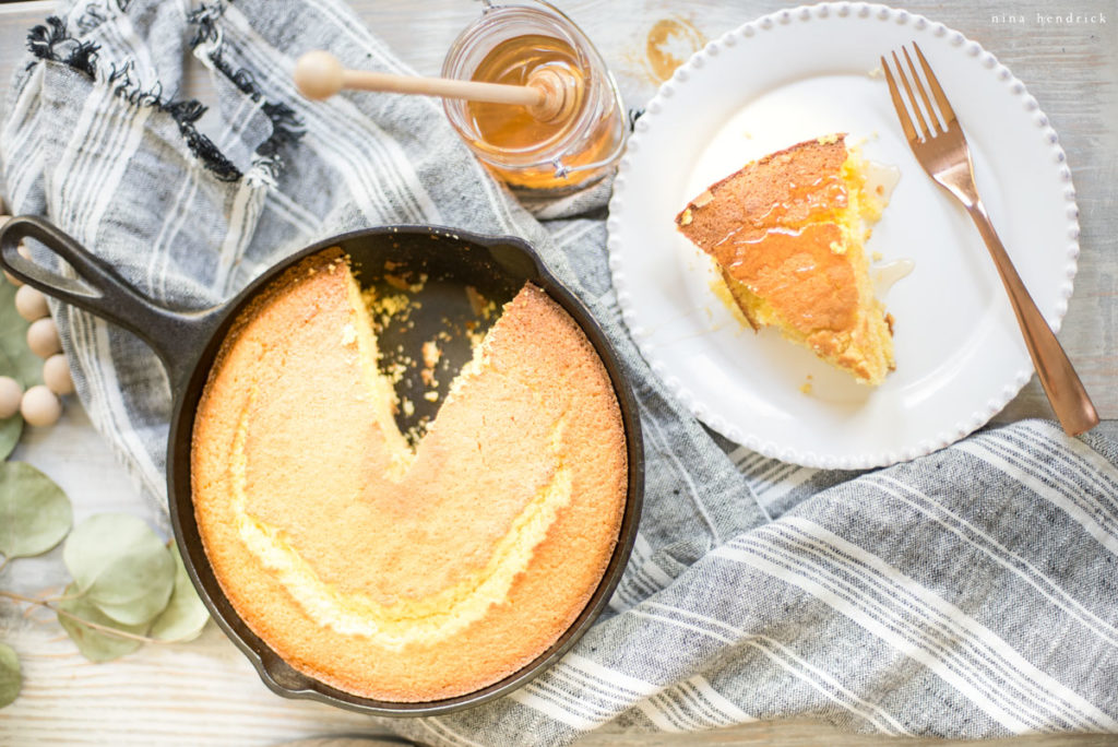 cornbread slice from lodge pan with honey