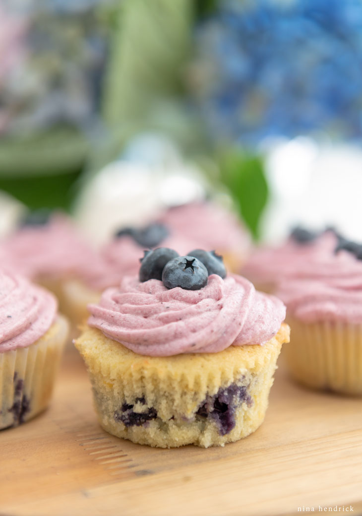 Lemon blueberry cupcakes with blueberry buttercream.
