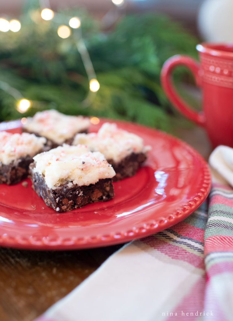 frosted brownies on a plate