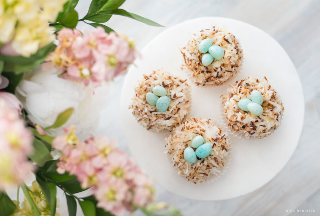 bird's nest cupcakes with toasted coconut and jelly beans